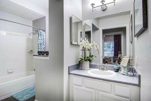 Luxurious bathroom featuring modern fixtures at The Prato at Midtown Apartments