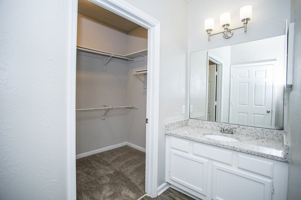 Luxurious bathroom with modern fixtures at The Prato at Midtown Apartments