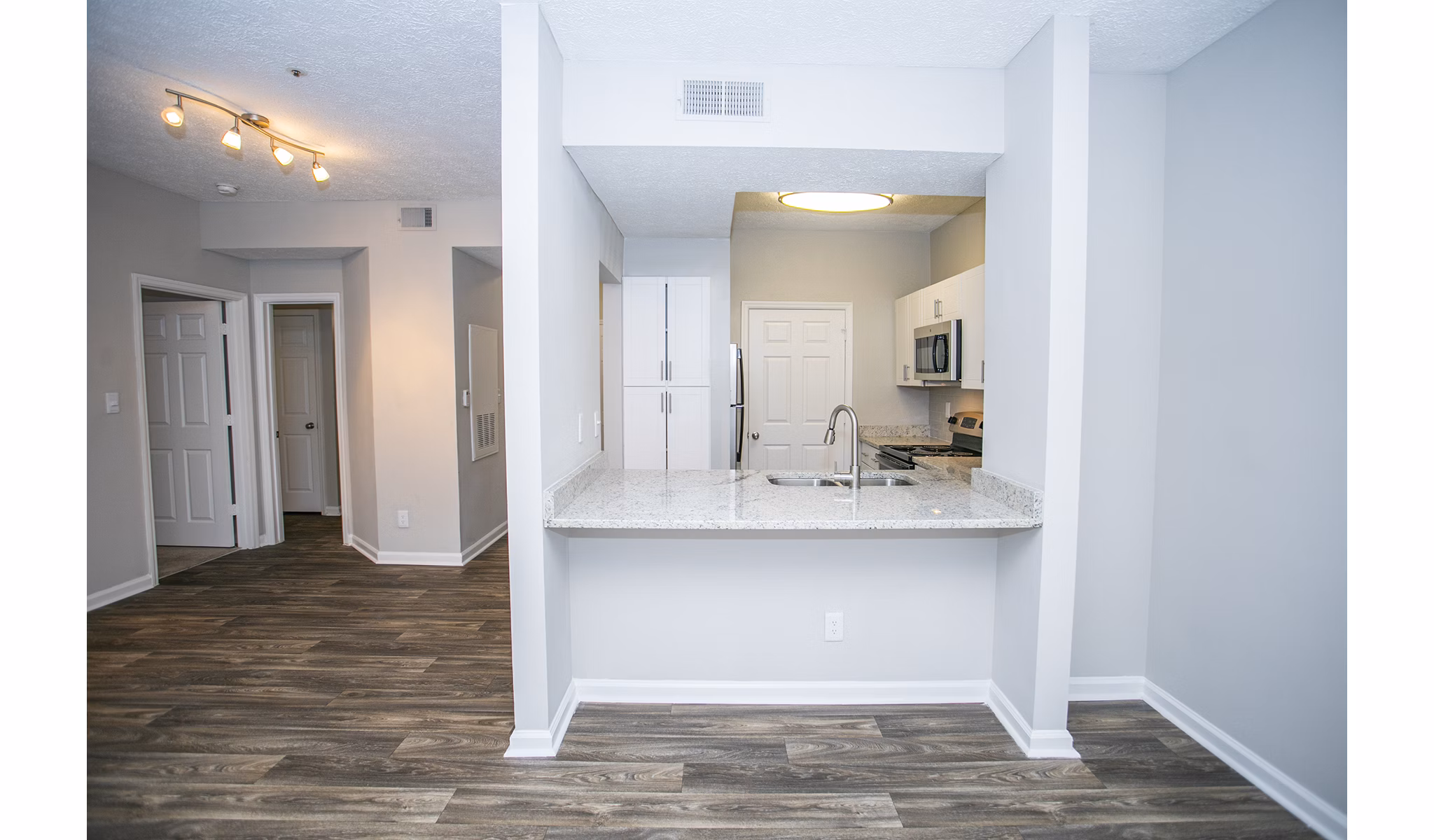 Elegant dining room with sleek furnishings at The Prato at Midtown Apartments