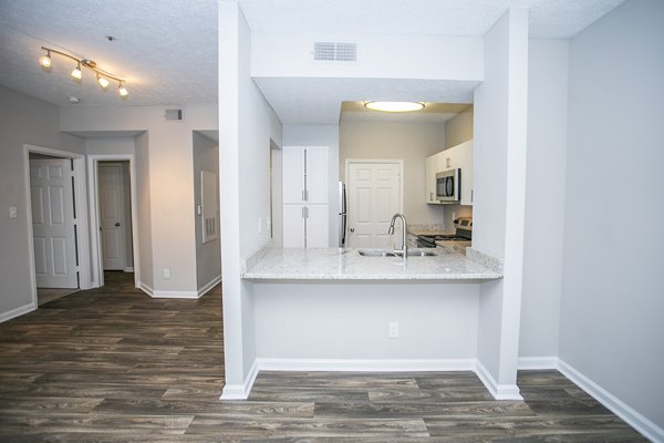 Elegant dining room with sleek furnishings at The Prato at Midtown Apartments