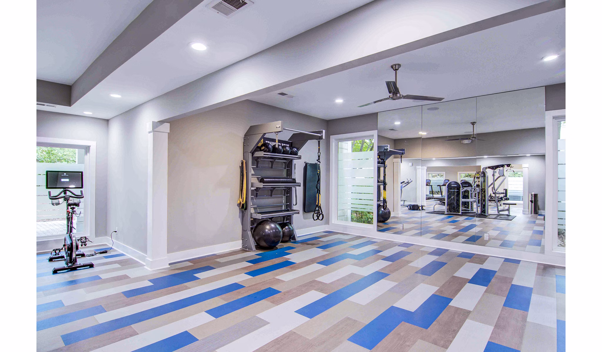 State-of-the-art fitness center with modern equipment at The Prato at Midtown Apartments