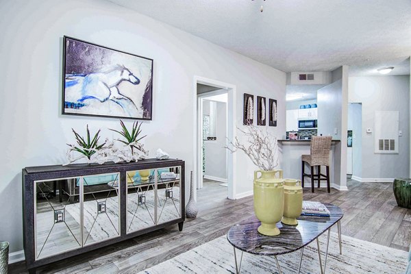 Bright living room with modern furnishings at The Prato at Midtown Apartments