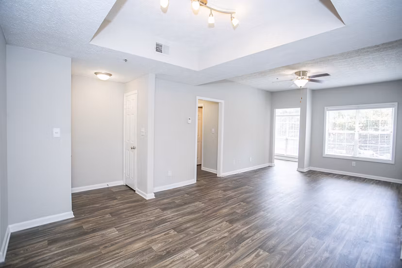 Elegant living room with modern furnishings in The Prato at Midtown Apartments