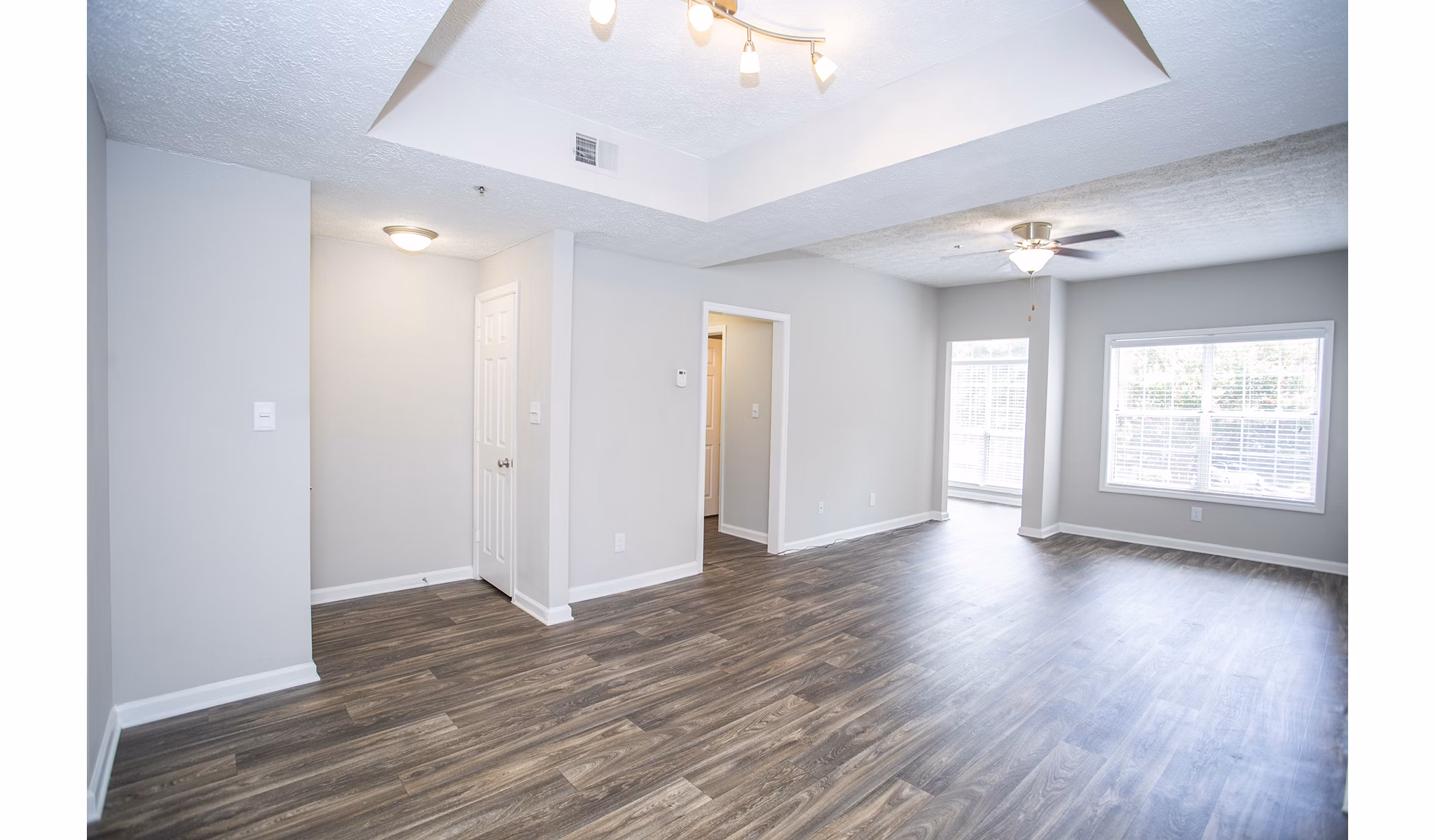 Elegant living room with modern furnishings in The Prato at Midtown Apartments