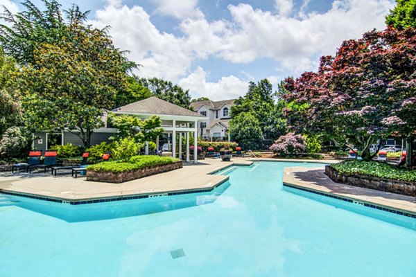 Expansive resort-style pool at The Prato at Midtown Apartments, perfect for relaxation and leisure in a luxury setting