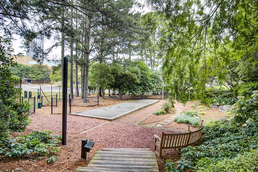 Bocce court and dog park at The Prato at Midtown Apartments offering community-friendly outdoor recreation spaces