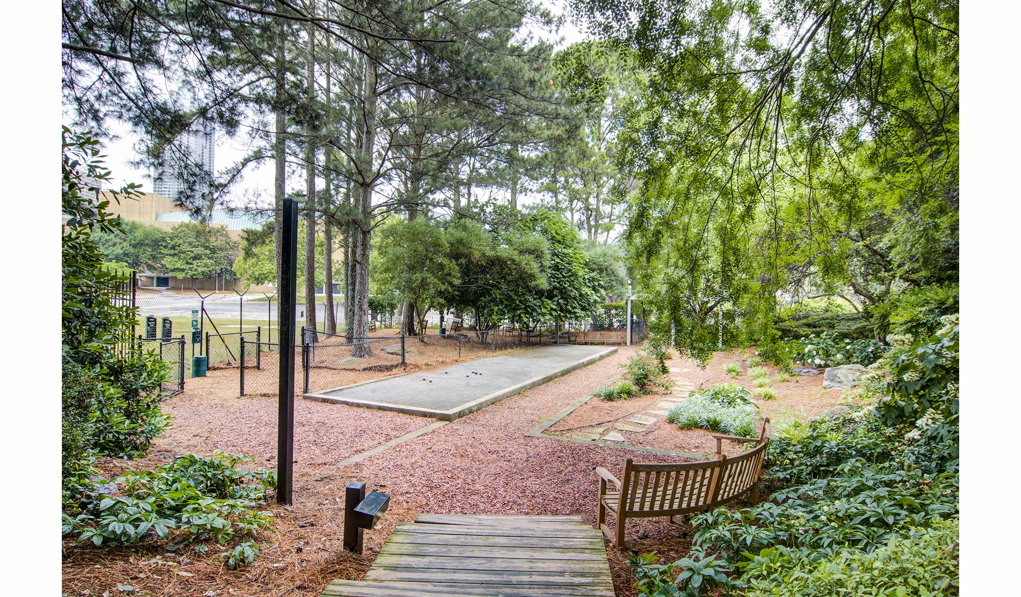 Bocce court and dog park at The Prato at Midtown Apartments offering community-friendly outdoor recreation spaces
