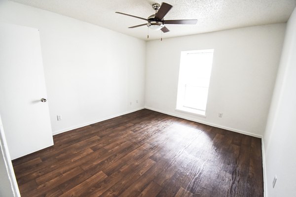 Cozy bedroom with modern furnishings in Waterloo Flats Apartments