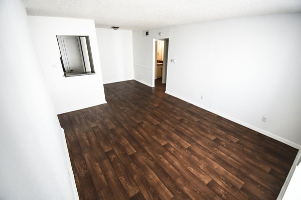 Cozy bedroom with modern decor in Waterloo Flats Apartments, featuring ample natural light and luxury finishes