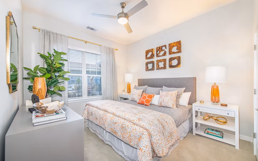Bedroom with modern design and large windows at Overture Centennial Apartments for luxurious living