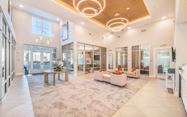Clubhouse featuring modern furnishings and open seating areas at Overture Centennial Apartments Ideal for social gatherings and relaxation in luxury setting