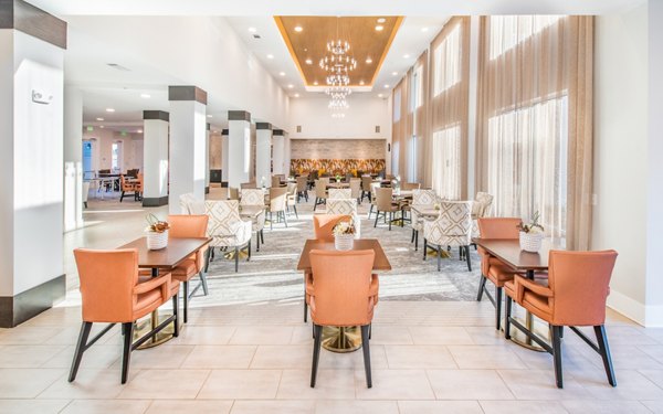 Clubhouse featuring modern interiors and seating areas at Overture Centennial Apartments, luxury living by Greystar