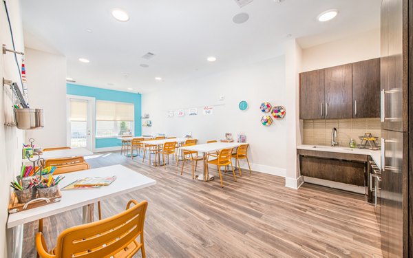 Modern clubhouse featuring stylish seating and game areas at Overture Centennial Apartments, ideal for luxury living and social gatherings