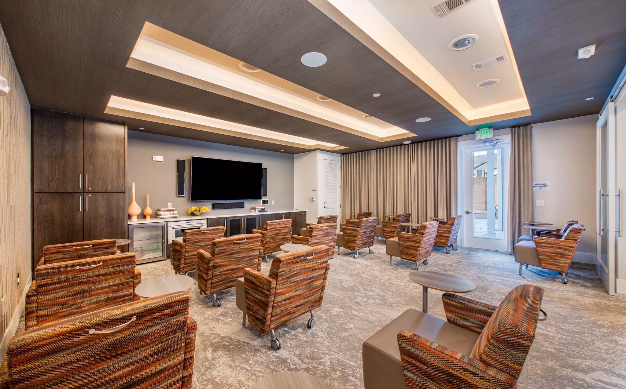Theater with plush seating and state-of-the-art acoustics at Overture Centennial Apartments, a luxury Greystar community