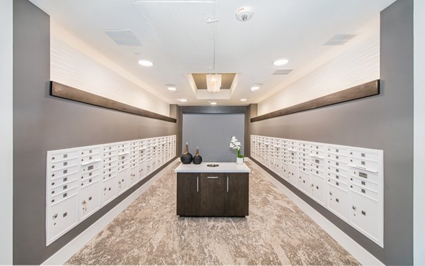Mail room with modern design at Overture Centennial Apartments, offering convenient package storage solutions for residents