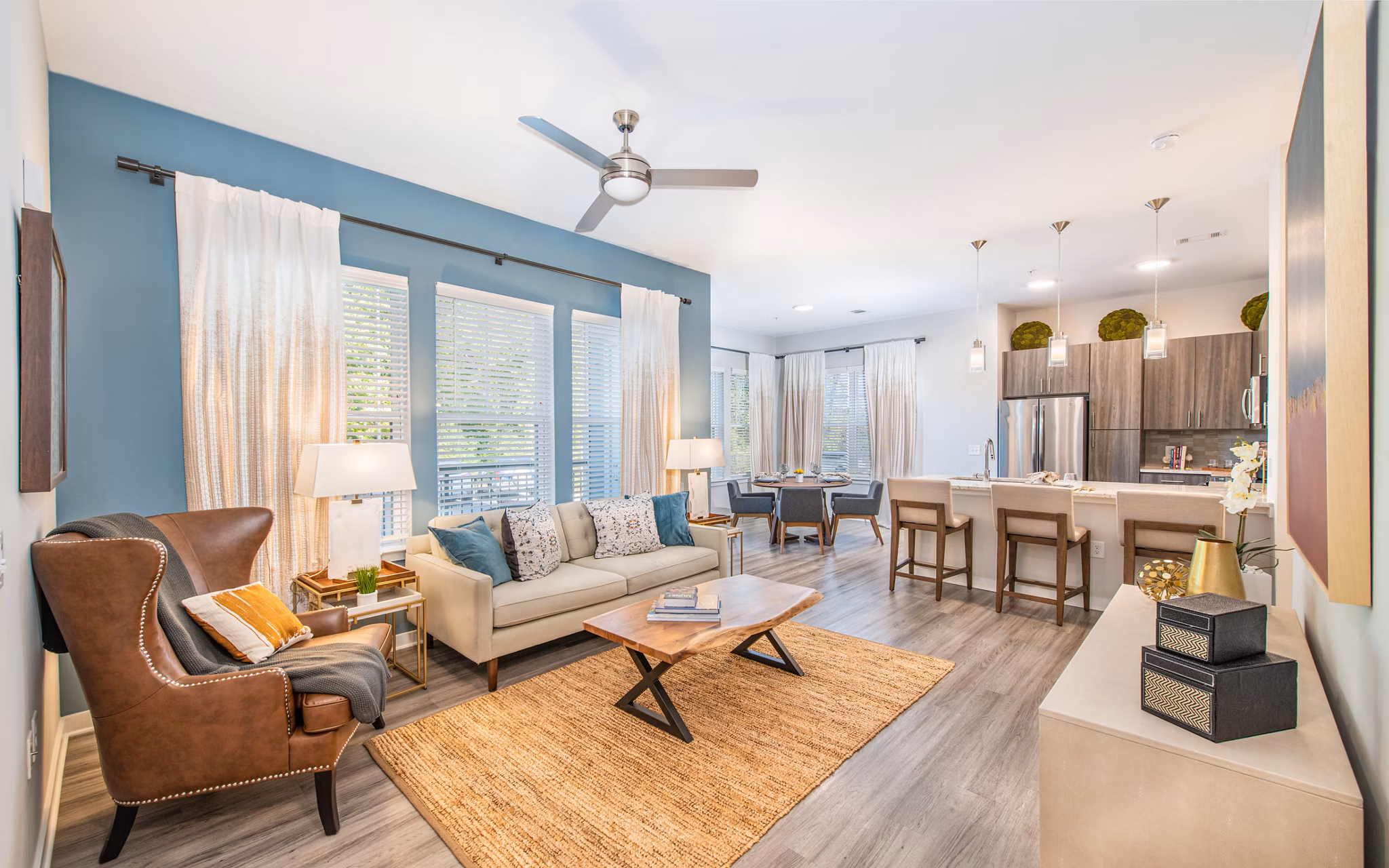 Spacious living room with modern furnishings in Overture Centennial Apartments