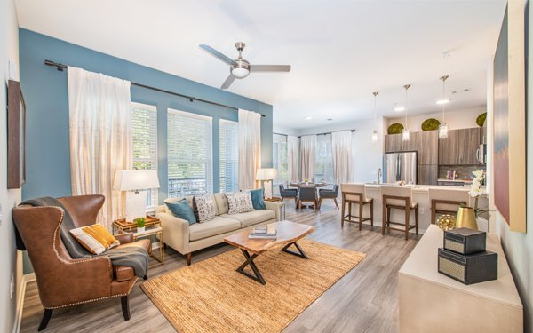 Spacious living room with modern furnishings in Overture Centennial Apartments