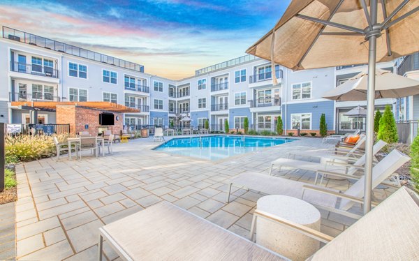 Beautiful lounge area with pool at Overture Centennial Apartments, offering luxury living at Greystar community