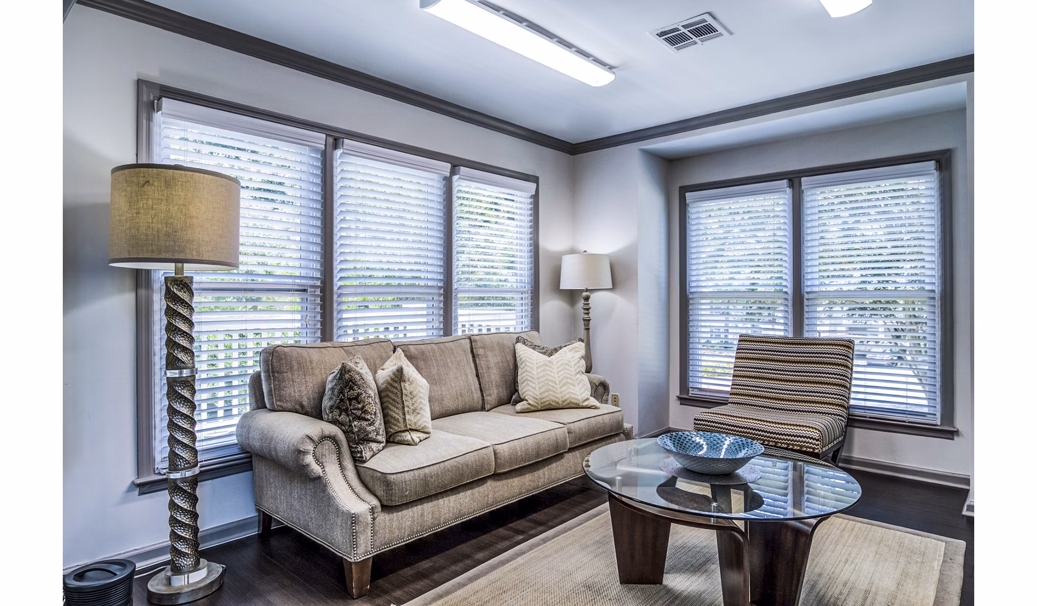 Clubhouse with modern seating and entertainment options at Junction at Vinings Apartments