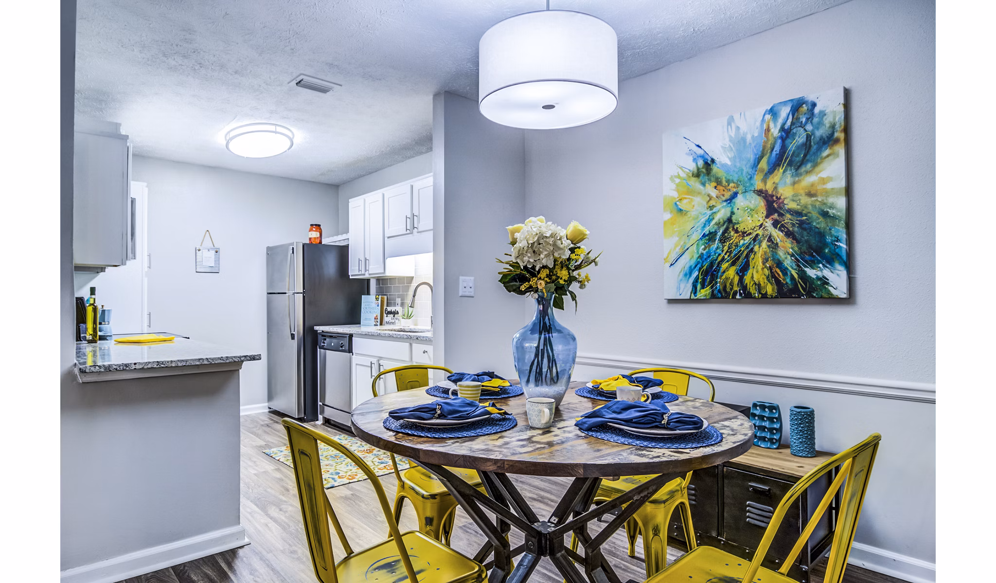 Dining room with modern decor and pendant lighting in Junction at Vinings Apartments
