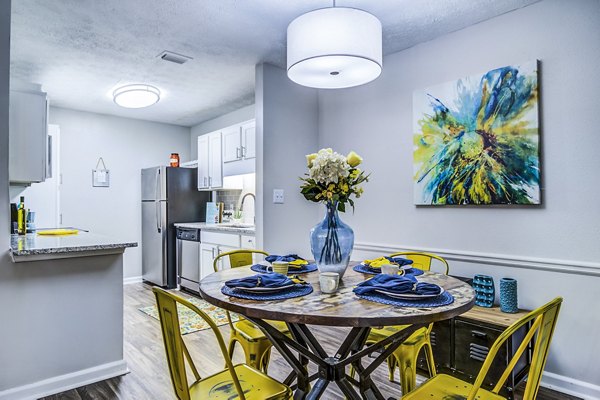 Dining room with modern decor and pendant lighting in Junction at Vinings Apartments