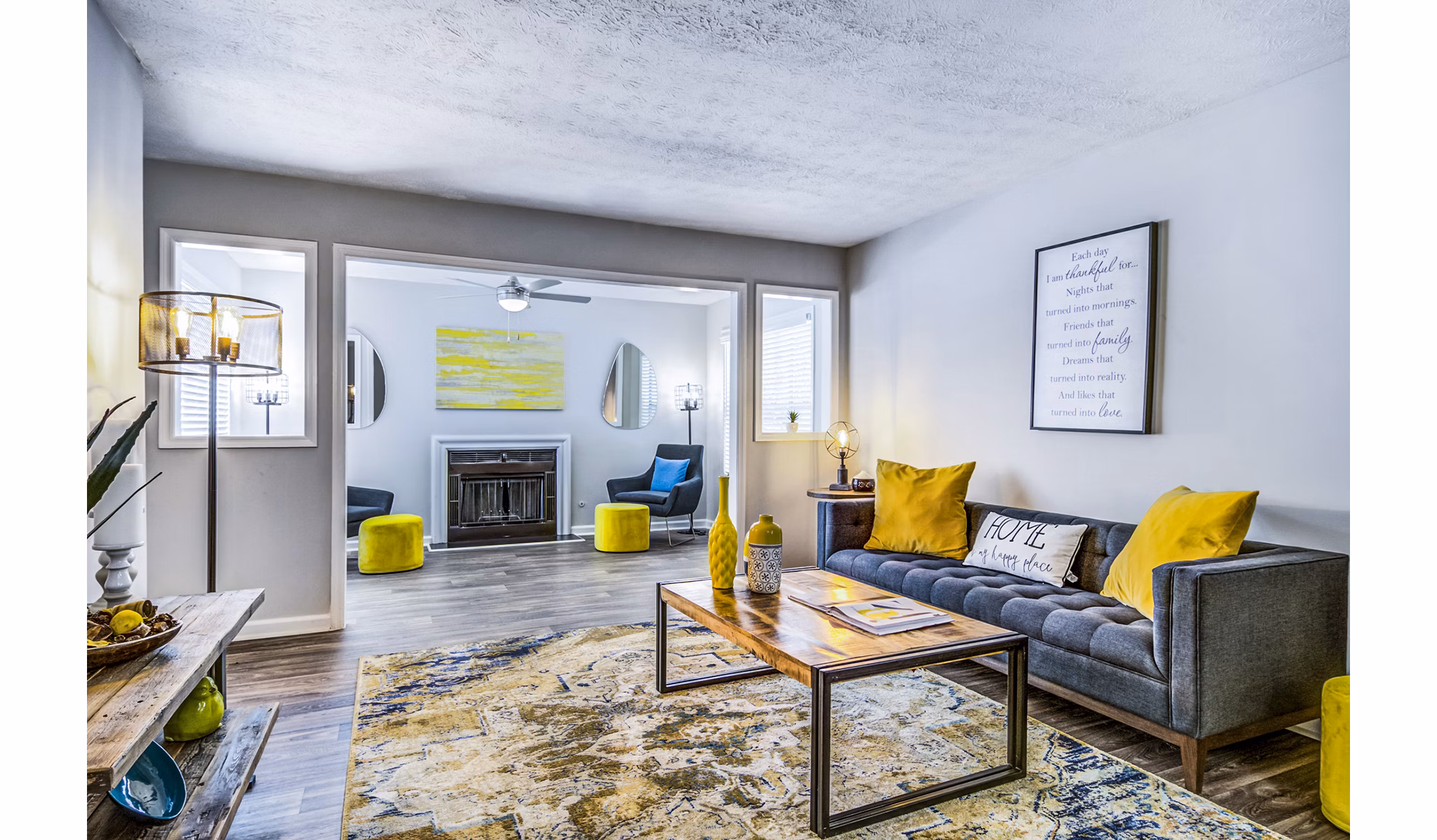 Spacious living room with modern furnishings in Junction at Vinings Apartments