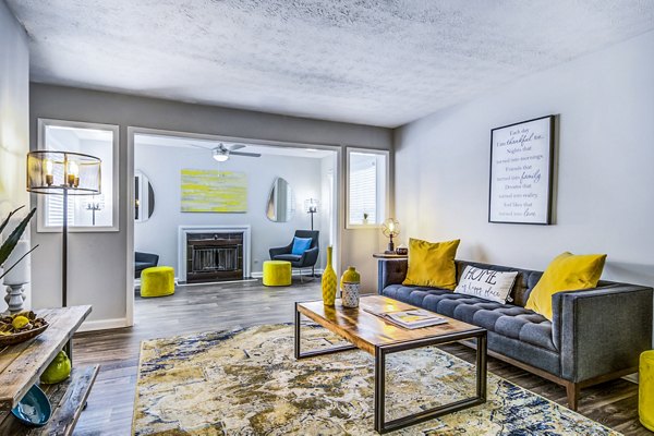 Spacious living room with modern furnishings in Junction at Vinings Apartments