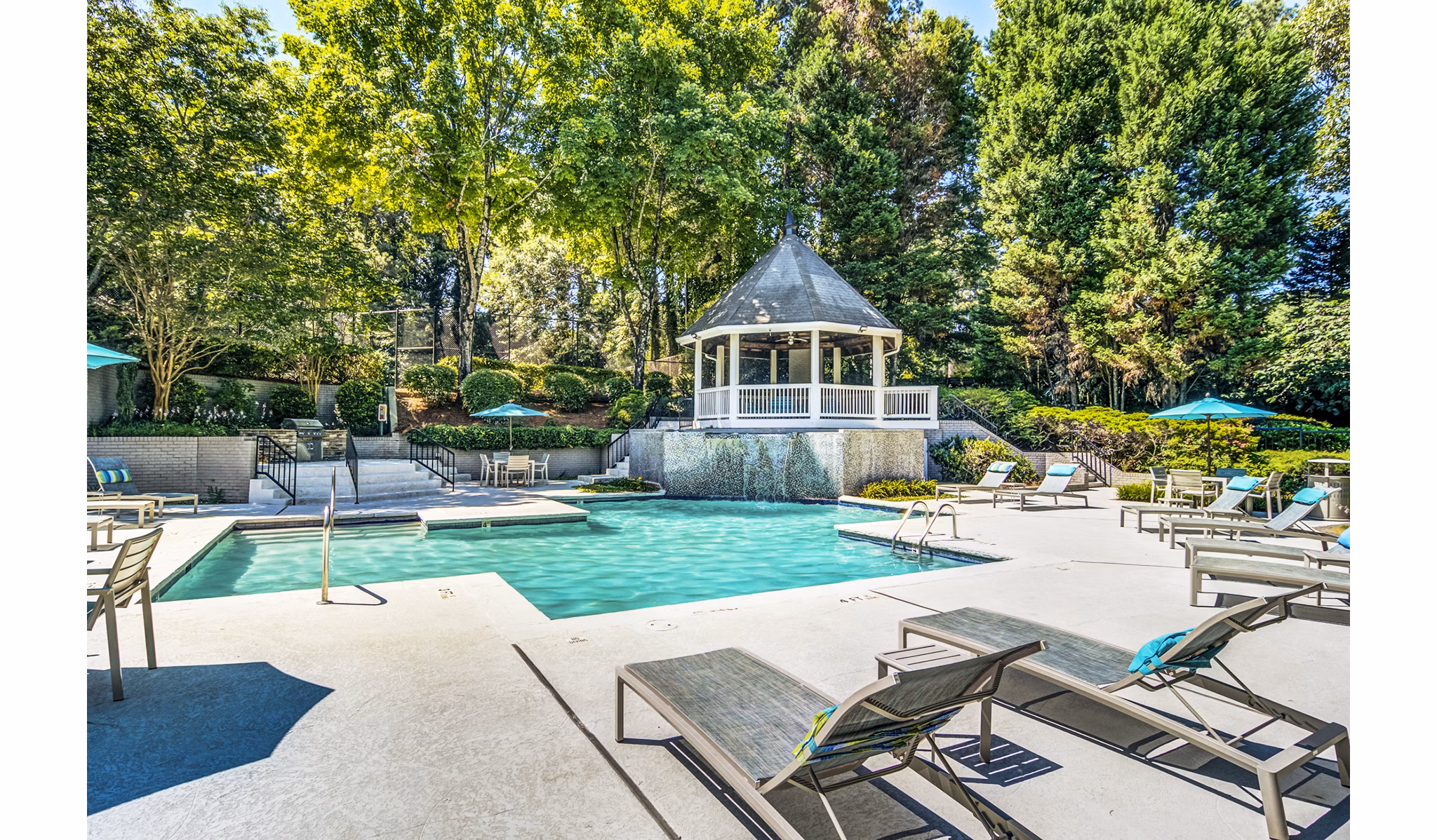 Rooftop pool with spacious sun deck at Junction at Vinings Apartments