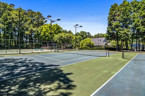 Outdoor tennis court at Junction at Vinings Apartments featuring modern facilities for residents