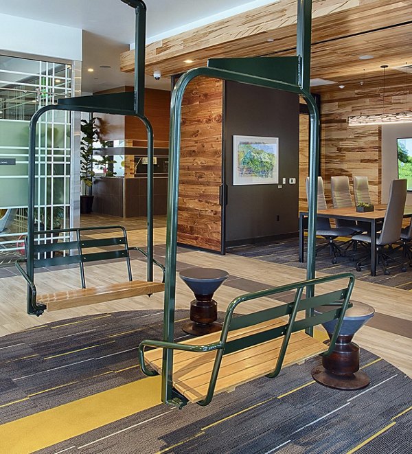 Modern clubhouse with lounge seating and fireplace at SOVA Apartments