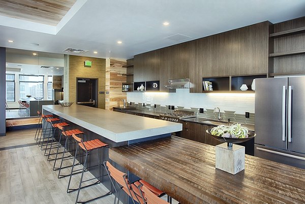 Clubhouse featuring modern design and ample seating at SOVA Apartments in downtown, offering luxury living spaces and amenities for residents