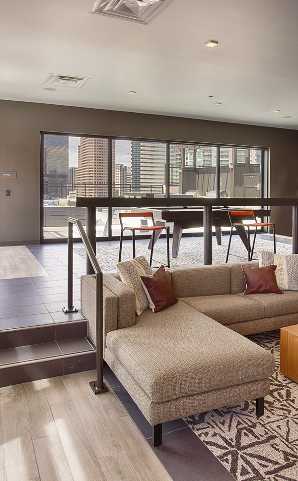Clubhouse featuring modern design and communal seating in SOVA Apartments, luxury living in a vibrant neighborhood