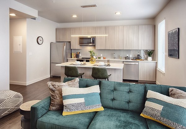 Spacious living room with modern furnishings at SOVA Apartments by Greystar