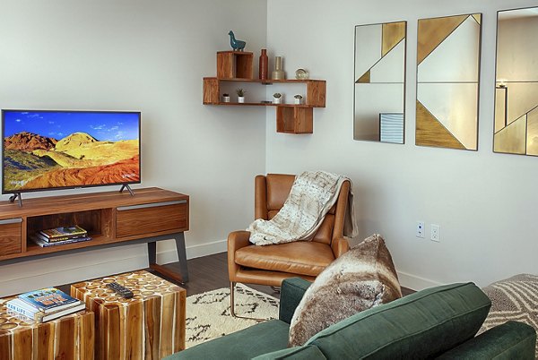 Spacious living room with modern decor at SOVA Apartments, luxury rental by Greystar