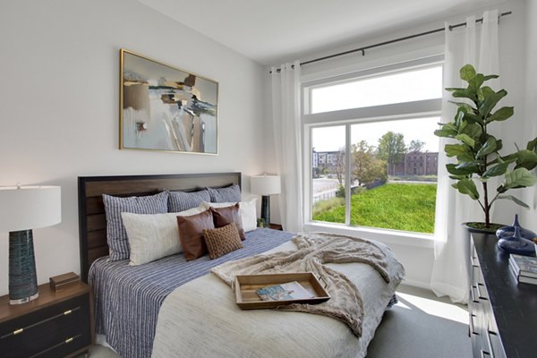 Modern bedroom featuring stylish decor in Overture 9th + CO Apartments, a luxury residence by Greystar in vibrant urban setting