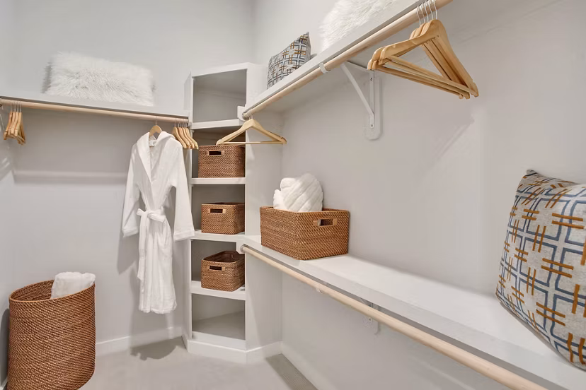 Walk-in closet with custom shelving at Overture 9th + CO Apartments