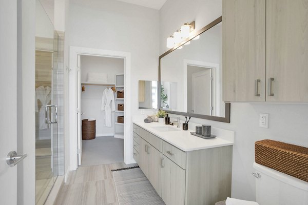 Modern bathroom with sleek fixtures at Overture 9th + CO Apartments