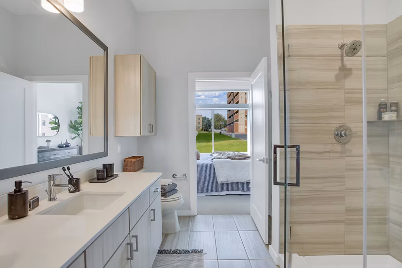 Modern bathroom with elegant fixtures at Overture 9th + CO Apartments, offering luxury living in a vibrant Denver community