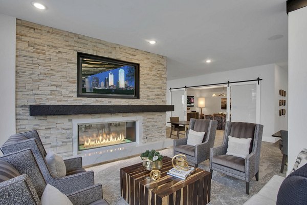 Clubhouse featuring modern design and cozy seating at Overture 9th + CO luxury apartments