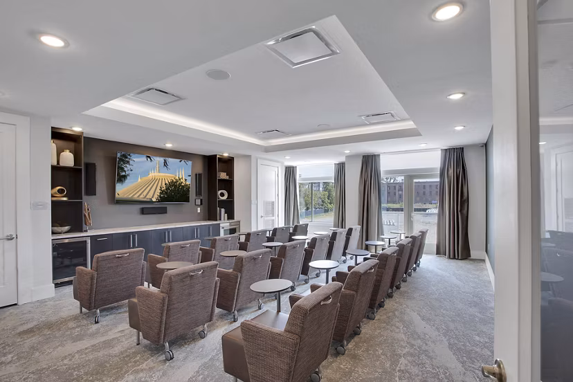 Theater room with plush seating at Overture 9th + CO luxury apartments