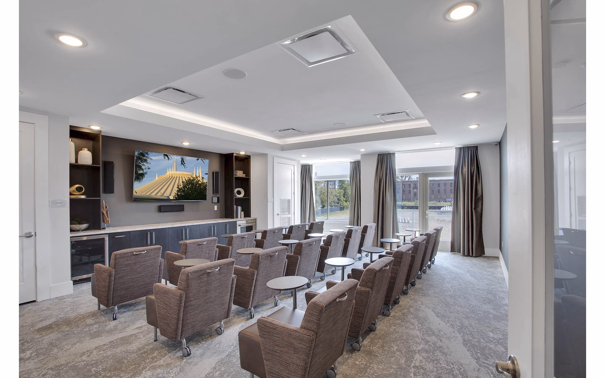 Theater room with plush seating at Overture 9th + CO luxury apartments