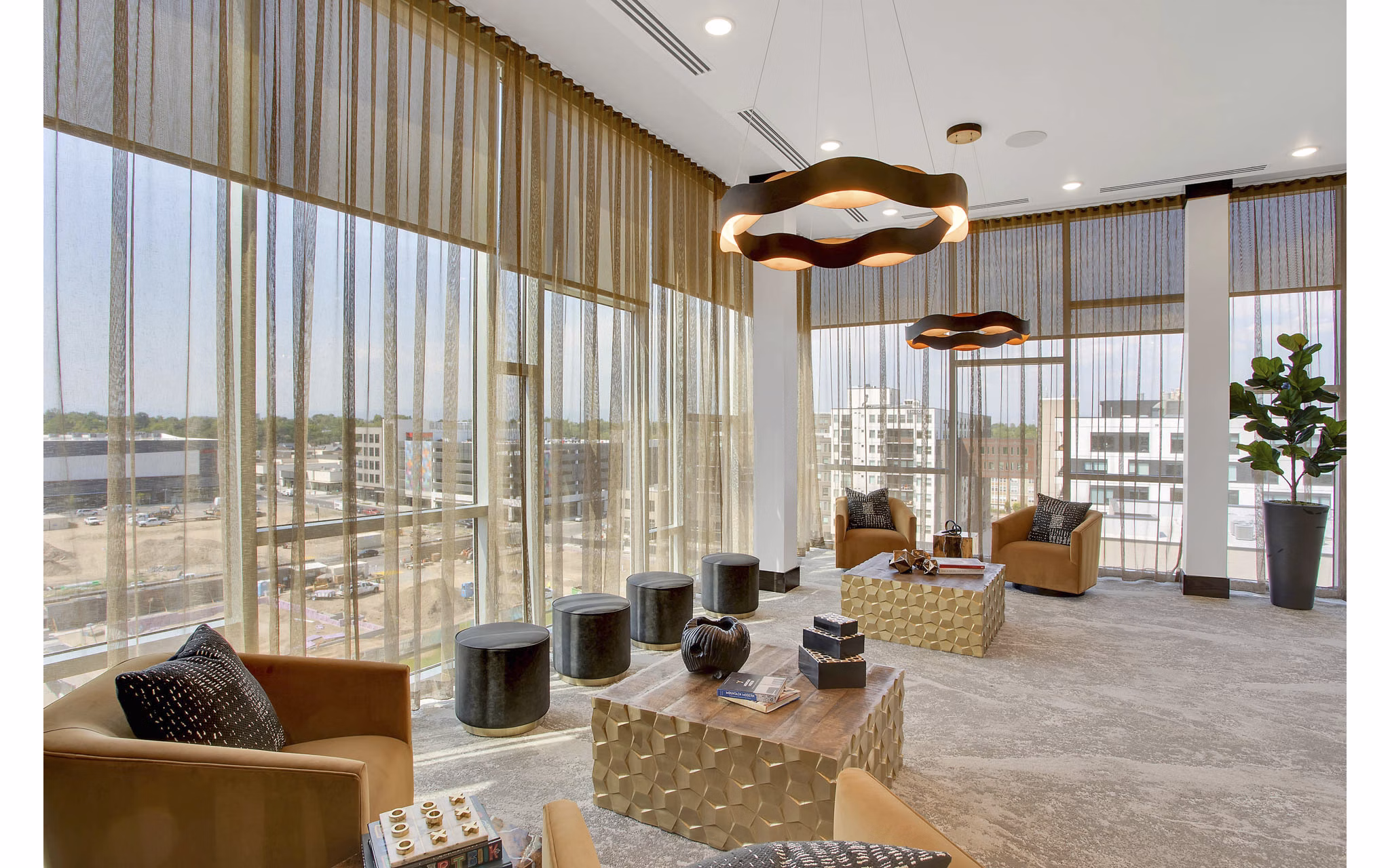 Clubhouse with modern design and seating at Overture 9th + CO Apartments Perfect for social gatherings and luxurious lounging