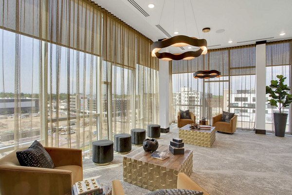 Clubhouse with modern design and seating at Overture 9th + CO Apartments Perfect for social gatherings and luxurious lounging