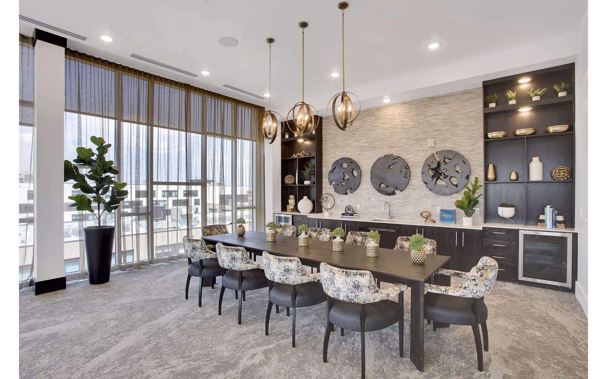 Clubhouse with modern decor and cozy seating at Overture 9th + CO Apartments, a Greystar luxury apartment community