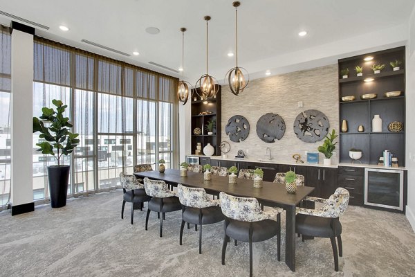 Clubhouse with modern decor and cozy seating at Overture 9th + CO Apartments, a Greystar luxury apartment community