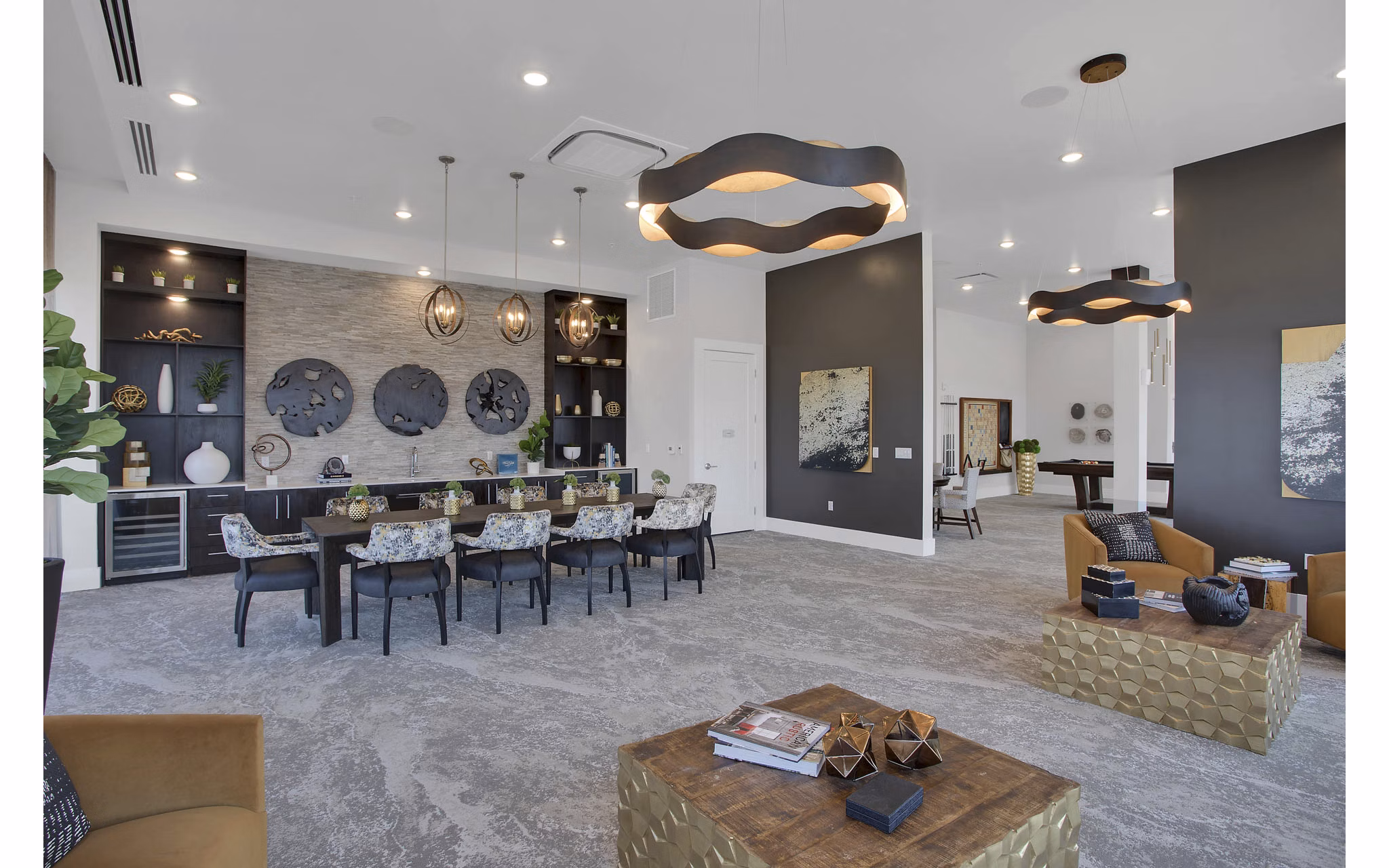Modern clubhouse with stylish seating and open spaces at Overture 9th + CO Apartments
