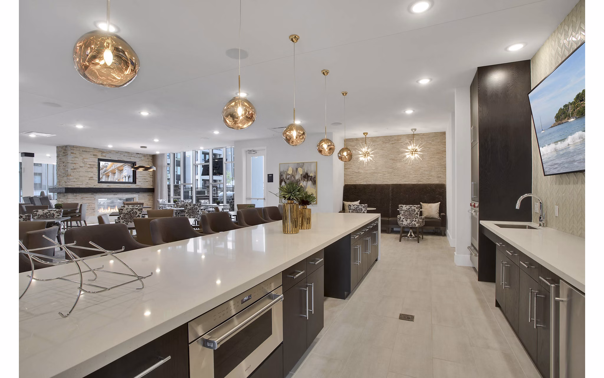 Clubhouse featuring modern design and comfortable seating at Overture 9th + CO Apartments, a luxury Greystar community