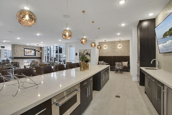 Clubhouse featuring modern design and comfortable seating at Overture 9th + CO Apartments, a luxury Greystar community
