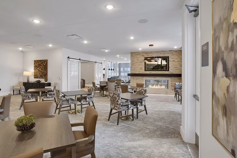 Stylish clubhouse with modern furnishings at Overture 9th + CO Apartments, perfect for leisure and gatherings in a luxury setting