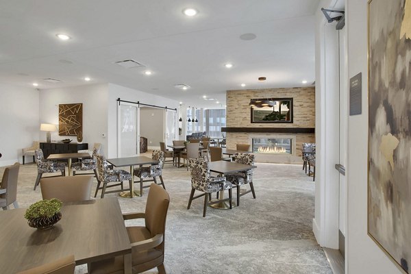 Stylish clubhouse with modern furnishings at Overture 9th + CO Apartments, perfect for leisure and gatherings in a luxury setting